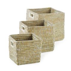 three wicker baskets with handles on each side