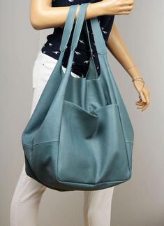 Blue Oversized leather bag, very large soft handbag, Height: 39 cm / 15.3"Height from top of handle to base: 68 cm / 26.8"Handle drop: 26 cm / 10.2"Width: 34 - 74 cm / 13.4" - 29.1"Depth: 28 cm / 11"- Large, very roomy bag made of soft distressed leather. - Unlined- Inside two spacious section.- Top closure magnet for security.Add this gorgeous bag to your collection!!To return to my shop, simply click here:  https://www.etsy.com/shop/BarbaraLeatherDesign***************************************** Blue Soft Leather Hobo Bag For Travel, Blue Soft Leather Hobo Bag For Everyday, Leather Hobo Bag With Pockets For Errands, Blue Soft Leather Hobo Bag For Errands, Blue Soft Leather Hobo Shoulder Bag, Blue Soft Leather Hobo Bag With Double Handle, Blue Soft Leather Hobo Bag For Shopping, Blue Leather Hobo Bag With Large Capacity, Blue Large Capacity Weekender Tote Bag