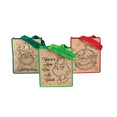 three christmas gift tags with green ribbon and santa's face on them, one for each