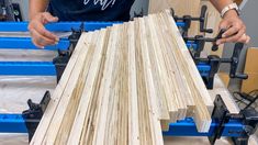 a person working on some wood in a shop