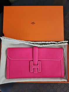 Hermes most beautiful pink! Super rare pink color of Rose Tyrien. Condition is Preowned but excellent. Please refer to pictures, if you need more pics please just ask :) 🌹Hermes Jige clutch 🌹Rose Tyrien color 🌹Epsom Leather. X Stamp 🌹Prestine condition Include Box, dustbag Due to high fees, if you want to pick up in LA area please private message me. only ship USA domestic.  I do signature. I also video & take pics of my packing/delivery to prevent disputes. Measurement is done by hand, there might be slight difference. I always & only support AUTHENTIC Items. Please buy with confident. I don't own a store, so No refund or return policy is strictly enforced. If you try to dispute to return this item due to authenticity, you need to provide a written authentication letter within 3 days Luxury Pink Rectangular Clutch, Luxury Pink Evening Clutch, Luxury Pink Clutch, Luxury Pink Clutch As Gift, Luxury Pink Clutch For Formal Occasions, Luxury Pink Pouch Clutch, Pink Rectangular Wallet With Original Box, Luxury Pink Pouch Wallet, Pink Travel Clutch Wallet