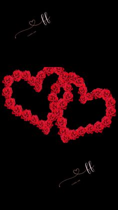 two hearts made out of red roses on a black background with the word love spelled in cursive writing