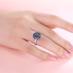 In a stunning display of style and craftsmanship, this spinning ring is brought to you. A combination of light blue, midnight blue, yellow gold and white stones, this ring is a premium miniature version of Van Gogh's timeless Starry Night painting. This piece of work reminds us to trust our dreams and not believe the critics of the world. "There is always hope, even in the darkest of times." So trust your dream and let this alluring jewelry make a statement. This spinning ring is not only a fash Blue Cluster Promise Ring In Fine Jewelry, Blue Sparkling Stones Wedding Ring, Blue Promise Rings With Diamond Accents, Blue Diamond Rings With Sparkling Stones, Luxury Blue Cluster Ring As A Gift, Blue Ring With Pave Setting For Gift, Sapphire Rings With Pave Setting As Gift, Blue Sparkling Wedding Rings, Luxury Blue Cluster Ring As Gift