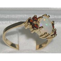 an opal and garnetia ring on display