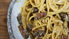 pasta with mushrooms and sauce in a bowl