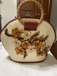 This handmade bag is beige with a combination of handmade flowers colors varies from beige, bronze, and brown! Very neutral and this bag can go with anything! The picture does no justice! free shipping Brown Straw Shoulder Bag As Gift, Brown Shoulder Straw Bag As Gift, Brown Straw Shoulder Bag Gift, Beige Flower-shaped Shoulder Bag For Beach, Handmade Brown Top Handle Straw Bag, Elegant Handmade Brown Straw Bag, Top Handle Bags, Handmade Bag, Handmade Flowers