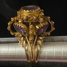 Stunning Etruscan Revival Amethyst And Gold Ring. This Is An Exquisite Hand Made Vintage Ring Designed In The Style Of A Royal Crown. A One Of A Kind Ring. It Has 5 Amethysts, 1 On The Top & 4 On The Sides. More Beautiful In Person Actually. It Is Set In Both 14k & 18k Gold. Actual Appraisal Is Shown Plus Poshmark With Also Authenticate It Free For The Buyer. Free Shipping On This Ring. Pentecost, Crown Royal, Top 4, Vintage Ring, Purple Gold, Womens Jewelry Rings, Vintage Rings, Ring Designs, Gold Ring