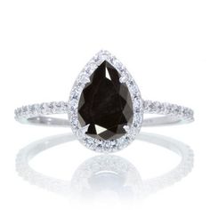 a pear shaped black and white diamond ring