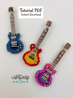 three different colored guitars made out of beads