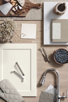 an overhead view of a kitchen counter with utensils, napkins and other items