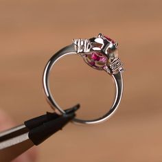 It is a lab ruby ring. The main stone is 6mm*8mm oval cut, weight about 1.75carats. The basic metal is sterling silver and plated with rhodium. To change the metal to a solid gold (white/rose) or platinum is also available, please ask for a quotation if you want. You can also go to my shop Home for more elegant rings: https://www.etsy.com/shop/godjewelry?ref=hdr_shop_menu More rings: https://www.etsy.com/shop/godjewelry?ref=l2-shop-header-avatar Customization is always welcome and please feel fr Oval Lab-created Ruby Diamond Promise Ring, Oval Lab-created Ruby Promise Ring, Oval White Gold Ruby Promise Ring, Silver Diamond Ring With Oval Lab-created Ruby, Silver Oval Diamond Ring With Lab-created Ruby, Silver Diamond Ring With Lab-created Ruby In Oval Shape, Silver Ruby Ring For Valentine's Day, Silver Cubic Zirconia Ruby Ring For Proposal, Silver Oval Ring With Lab-created Ruby