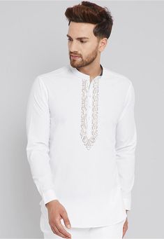 Poly Cotton Short Kurta in White This Readymade attire is Enhanced with Buttons and Resham Work. Crafted in Chinese Collar Neck and Full Sleeve Do note: Bottom and Footwear shown in the image is for presentation purposes only. Half to one inch may vary in measurement. (Slight variation in actual color vs. image is possible) Festive White Kurta With Embroidered Sleeves, Eid White Kurta With Embroidered Sleeves, White Long Sleeve Kurta With Embroidered Sleeves, White Cotton Tops For Eid, White Tops With Intricate Embroidery For Festive Season, White Intricate Embroidery Festive Top, Festive White Top With Intricate Embroidery, White Embroidered Top For Eid, Festive White Top With Embroidered Sleeves