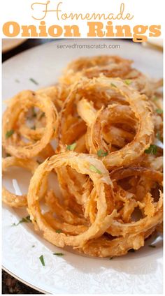 homemade onion rings on a white plate