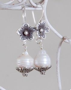 Choose from 3 beautiful pearl earring sets. 1. Sterling silver flower hook with fresh water pearl cupped in sterling silver flower post. 1 1/4 inch drop. 2. Cultured Pearl with Swarovski crystal post. Sterling silver hook. 1 inch drop. 3. 2 fresh water pearls, 1 irregular pearl hangs above white coin pearl. 1 1/2 inch drop. Convo me with any questions or additional questions. Silver Pearl Drop Flower-shaped Earrings, Silver Flower Earrings With Pearl Drop, Silver Sterling Flower Earrings With Pearl Drop, Silver Sterling Pearl Drop Flower Earrings, Silver Flower Jewelry With Pearl Drop, Silver Flower-shaped Jewelry With Pearl Drop, White Flower Earrings With Pearl Drop For Jewelry Making, Silver Pearl Drop Flower Earrings, Silver Flower Pearl Earrings For Anniversary