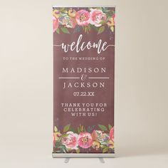 a purple welcome sign with flowers on it and the words,'welcome to the wedding of madison & jackson '