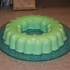 a green bundt cake sitting on top of a counter