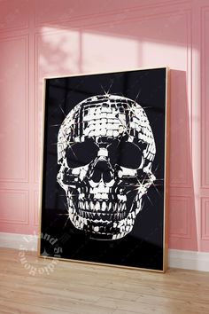 a skull with sunglasses on it's face is shown in front of a pink wall