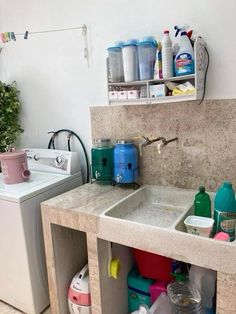 a kitchen with a sink, washer and dryer