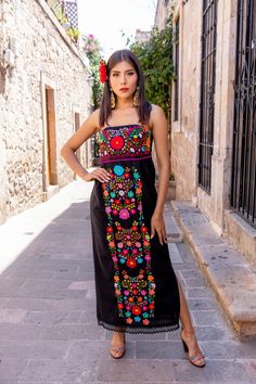 This Beautiful Strapless Dress boasts a Traditional Mexican floral design combined with a modern style dress. It's made out of fine Mexican cotton and has elastic on the back for a tighter fit. It has hand embroidered flowers and hand knit details throughout. This dress is handmade by Mexican Artisans in Mexico. Note: Since this dress is Hand embroidered the embroidered colors on each dress vary, making them one of a kind. The jewelry modeled you can find here: https://www.etsy.com/es/listing/92 Multicolor Maxi Dress With Floral Embroidery, Multicolor Floral Embroidered Maxi Dress For Party, Multicolor Sleeveless Embroidered Dress For Party, Multicolor Sleeveless Dress With Floral Embroidery, Fitted Multicolor Embroidered Maxi-length Dress, Sleeveless Multicolor Floral Embroidered Maxi Dress, Sleeveless Multicolor Maxi Dress With Floral Embroidery, Multicolor Sleeveless Maxi Dress With Floral Embroidery, Bohemian Multicolor Sleeveless Embroidered Dress