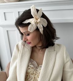 Comprised of Cream Silk Charmeuse our Silk Orchid Barrette is entirely handmade in NYC. Everlasting and robust this gorgeous barrette is a must have, a statement floral of everones' favorite transporting us to an ethereal place of eternal spring. Each petal is painstakingly pressed and detailed to create its lifelike allure. Made in NYC. Elegant Hair Accessories For Spring Ceremonies, Elegant Spring Ceremony Hair Accessories, Elegant Flower Hair Accessories With Handmade Flowers, Elegant Flower-shaped Hair Accessories With Handmade Flowers, Elegant Handmade Flower Hair Accessories, Elegant Handmade Flowers Fascinator, Handmade Flowers Fascinator For Formal Occasions, Elegant Handmade Flowers Headband, Elegant Flower Headpieces For Gifts