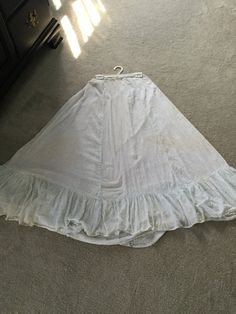 1800's Prairie Skirt, Light Blue Print, faded With Ruffle and Lace at Bottom. Very small waist. Fair Condition Fitted Vintage Ruffled Skirt Bottoms, Vintage Fitted Ruffled Skirt Bottoms, Vintage Long Ruffled Petticoat, Vintage Fitted Bottoms With Ruffled Skirt, Vintage Long Gathered Skirt Bottoms, Vintage Long Gathered Skirt, Vintage Tiered Petticoat With Lined Skirt, Vintage Ruffled Skirt Petticoat, Vintage Long Skirt Petticoat