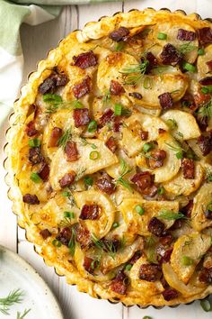 a quiche with bacon, cheese and herbs