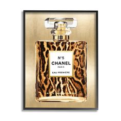 a bottle of chanel no 5 eau perfume in gold and leopard print on a white background