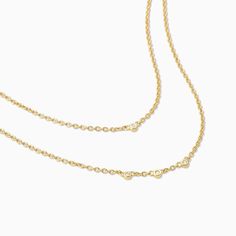 Add some gold layers to your look with our Layered Chain Vermeil Necklace. Crafted from 18k gold over sterling silver, this pre-layered necklace is an effortless, yet still elevated piece every jewelry collection needs. Did we mention it also has real, slightly included round-cut diamonds? Now you really need this gold necklace. Gold Double Chain Necklace In 14k Gold, Dainty Yellow Gold Double Chain Jewelry, Fine Jewelry Clavicle Chain Necklace For Layering, 14k Gold Double Strand Chain Necklace, Delicate Gold Layered Necklace In Sterling Silver, Everyday Yellow Gold Double Chain Necklace, Elegant Everyday Layered Cable Chain Necklace, Yellow Gold Cable Chain Charm Necklace For Layering, Dainty Double Chain Yellow Gold Charm Necklace