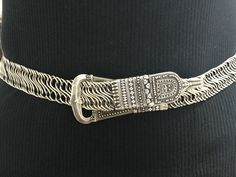 From my private collection this magnificent example of Arappatta.   An antique dowry belt handmade in Kerala, South India . High grade Indian silver 800/1000    77cm 350 grams Excellent condition with a beautiful patina. Early 20th century. Elegant Silver Belts For Festival, Silver Saree Belt, Silver Waist Belt For Saree, Elegant Silver Embroidered Belt, Traditional Festival Belt With Antique Buckle, Adjustable Silver Southwestern Belt, Vintage Silver Embroidered Belt, Pure Silk Dress, Vintage Silver Hand-tooled Belt