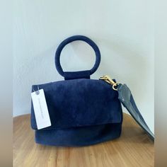 Brand New With Tags Can Transform From Crossbody To A Handy Clutch. Small But So Much Room Inside The Bag. Suede Navy Blue Never Worn! Here Are More Pics Inside Never Has It Been Used! Gorgeous For Fall Colors! Chic Blue Satchel Evening Bag, Blue Shoulder Bag With Round Handle For Evening, Blue Double Handle Shoulder Bag For Party, Blue Party Shoulder Bag With Double Handle, Navy Rectangular Shoulder Bag For Evening, Chic Blue Shoulder Bag For Evening, Blue Shoulder Bag With Detachable Strap And Round Handle, Chic Blue Evening Shoulder Bag, Chic Blue Evening Bag