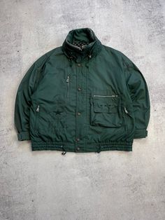 This Bogner Expedition Vintage Men's Green Jacket is a must-have for any ski or outdoor enthusiast. Made with high-quality polyester material, this mid-length jacket features a full zip closure and zipped pockets for your convenience. The oversized jacket is hooded and comes in a retro 90s style, perfect for all seasons. The green jacket is a size 52 and has a regular fit, making it suitable for most men. The jacket is made in Italy and is perfect for winter and fall seasons. The jacket's features include all-season suitability, making it a great investment for any outdoor activity. Size 52 (see measurements) The length of the sleeve from the neck is 80 cm From shoulder to shoulder - 65 cm The length of the back is 73 cm Condition 8/10  See all photos and read description.   If you need an Winter Outdoor Track Jacket With Pockets, Winter Track Jacket With Pockets For Outdoor, Winter Outerwear For Outdoor Activities With Zip Fly, Vintage Winter Parka With Multiple Pockets, Urban Winter Sport Coat For Outdoor, Utility Sport Coat For Winter Outdoor Activities, Winter Utility Sport Coat For Outdoor Activities, Winter Track Jacket With Zipper For Outdoor Activities, Sporty Outdoor Parka With Zipper Closure