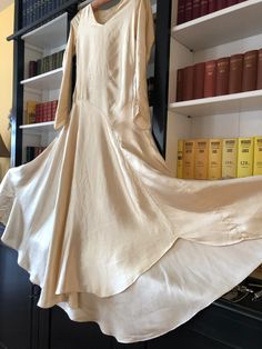 1920s Silk Satin Bride Dress With Wax Flower Posie | Etsy Silk Wedding Gown With Satin Finish, Cream Satin Bias Cut Dress, Satin Dress With Subtle Sheen For Wedding, Satin Wedding Dress With Subtle Sheen, Wedding Dress With Subtle Sheen In Satin, Cream Silk Gown For Wedding Night, Beige Silk Bias Cut Dress, Fitted Bias Cut Satin Wedding Dress, Fitted Bias Cut Satin Dress For Wedding