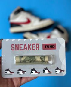 someone is holding up a fake sneaker money tube