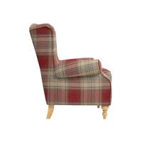 a red plaid chair sitting on top of a white floor