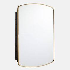 a mirror that is sitting on top of a wall next to a black frame and gold trim