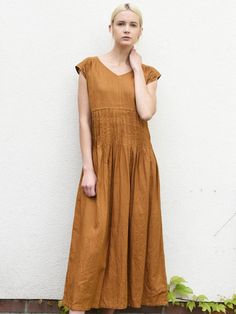 "Long linen dress with short sleeves and gorgeous pleats. The linen dress has vertical pleats on the front and back- around the midsection. Simple dress, but unique, romantic look. Comfortable and fresh design. Made in our workshop in Poland for you. Authentic Handmade. DETAILS: - 100% washed, softened, light linen. - Includes one linen dress - The images above show the turmeric and gray green colour - V neckline at the front - Bust darts to shape any figure - Shrinkage after the first wash up t Pleated Short Sleeve Maxi Dress For Summer, Casual Pleated Dress For Summer Daywear, Casual Summer Pleated Dress For Daywear, Casual Pleated Linen Dress For Summer, Summer Casual Pleated Dress, Summer Dresses With Pleated Hem And Short Sleeves, Summer Dresses With Pintucks And Short Sleeves, Summer Linen Pleated Dress, Spring Short Sleeve Maxi Dress With Pleated Waist