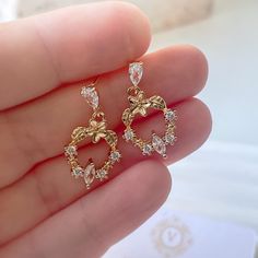 Wedding Earrings, Crystal Bridal Drop Earrings, Elegant Crystal Earrings, Small Earrings, Bridesmaid Earrings Gift, Minimalist Earrings. 💫 Delicate wedding earrings featuring an 18K Gold-Plated circular center adorned with sparkling cubic zirconia stones.  💫 The top part, plated in 14K gold, adds an extra touch of elegance, making them perfect for brides and bridesmaids alike.  💫 Crafted from hypoallergenic, nickel-free materials, these earrings ensure comfort throughout the entire day.   The lightweight design (4 grams per pair) offers a beautiful look without any heaviness. With a length of 0.96 inches (2.44 cm) and a width of 0.49 inches (1.24 cm), they bring a touch of timeless charm to any special occasion, from weddings to elegant evenings. Wedding Heart Drop Earrings Single Piece, Delicate Gold Heart Earrings For Wedding, Teardrop Cluster Earrings As A Gift, Elegant Heart Earrings For Wedding, Elegant Teardrop Heart Earrings For Wedding, Rose Gold Heart Drop Earrings For Wedding, Hypoallergenic Round Heart Earrings For Wedding, Hypoallergenic Heart Earrings For Wedding, Elegant Heart-shaped Drop Earrings For Wedding