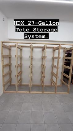 an empty storage room with shelves in the middle and text overlay that reads hdx 2 7 - gallon note storage system