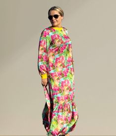 Imagine a maxi dress that flows elegantly to the floor, combining the luxurious sheen of silk with the soft comfort of cotton. The dress features long sleeves that gracefully drape down, providing a modest yet stylish look. The design is inspired by Persian aesthetics, incorporating intricate patterns and motifs reminiscent of Persian art and culture. The dress might include subtle embroidery or embellishments that reflect traditional Persian craftsmanship, adding a touch of timeless elegance to Spring Vacation Full-length Maxi Dress, Long Sleeve Maxi Dress For Vacation, Beach Modest Long Sleeve Maxi Dress, Modest Long Sleeve Maxi Dress For Beach, Modest Long Sleeve Maxi Dress For Vacation, Silk Long Sleeve Midi Dress For Beach, Silk Long Sleeve Midi Dress For Vacation, Spring Daywear Long Sleeve Silk Dress, Spring Silk Long Sleeve Dress For Daywear