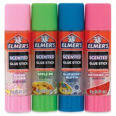 three different colors of glue stick