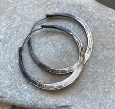 Sterling silver has been hammered into rustic hoops. The ombré effect is done with oxidation then clear coated. In order to maintain the color as long as possible, do not wear these earrings while showering or swimming. Overexposure to moisture or constant handling will wear down the clear coat and affect the ombré. ** listing is for ONE pair of hoops** You pick the diameter at checkout. 20 gauge Niobium earwires Silver not your color? I also make these in copper. Check out the rest of my shop. Hammered Iron, Ombre Earrings, Handmade Hoop Earrings, Hoops Silver, Long Statement Necklace, Syracuse Ny, Rustic Jewelry, Authentic Jewelry, Large Hoop Earrings