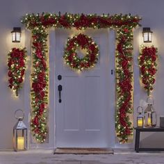 christmas wreaths and lights decorate the front door