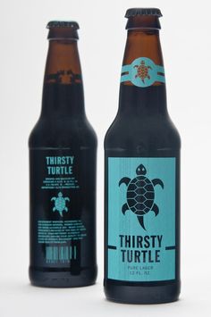 two bottles of thirsty turtle beer sitting next to each other