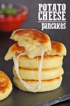 there is a stack of pancakes with cheese on top and the words potato cheese pancakes above it