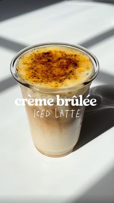 an iced latte in a plastic cup with the words creme brulee on it