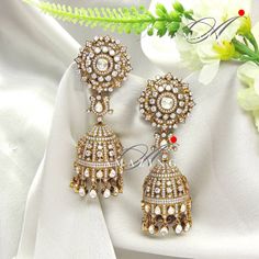 Silver Moissanite Polki Antique polish Jhumka, Polki Earring, Wedding Jewelery, Silver Moissanite Polki , Big Jhumka, Statement Earring Material : Silver Gemstone: Moissanite , Swarovski Stones Stone colour: Uncut Polki Primary colour: Gold Size-Length:70mm Width: 30mm Closure : Screw back and Clips Silver Intricate, hand crafted, Pure Silver Polki Earrings, Antique polish Jhumka studded with high quality Moissanite Polki and Swarovski Earring comes with screw back and clips, made in 92.5 silver Wedding Jewelery, Polki Earrings, Earring Wedding, Stone Colour, Earrings Antique, Swarovski Stones, Statement Earring, Swarovski Earrings, Body Spray