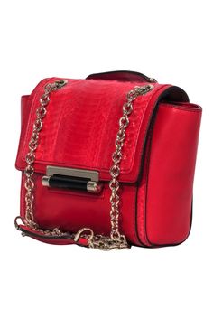 Get some red hot style with any outfit when you carry this textured treasure from Diane von Furstenberg! Perfect for wearing with any sparkling cocktail dress or even your favorite blouse and jeans combo for a night out, this is the perfect subtle statement bag for pop of color. Smooth leather with snakeskin accents Flap closure with snap button Gold-toned chain strap Strap can be shoulder bag length or crossbody length Two interior pockets Dustbag included Width 7.5" Height 6.5" Depth 1.75" Str Leather Evening Bag With Chain Strap For Party, Elegant Red Evening Bag For Shopping, Red Evening Bag With Detachable Strap, Chic Red Shoulder Bag For Evening, Trendy Red Evening Bags, Luxury Red Evening Bag For Formal Occasions, Red Shoulder Bag With Detachable Strap For Evening, Chic Red Evening Bag With Gold-tone Hardware, Elegant Red Evening Bag With Chain Strap