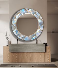 a round mirror on the wall above a sink