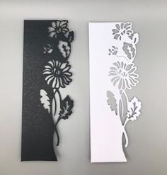 two pieces of paper cut out to look like flowers