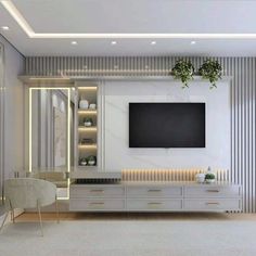 a living room filled with furniture and a flat screen tv mounted to the side of a wall